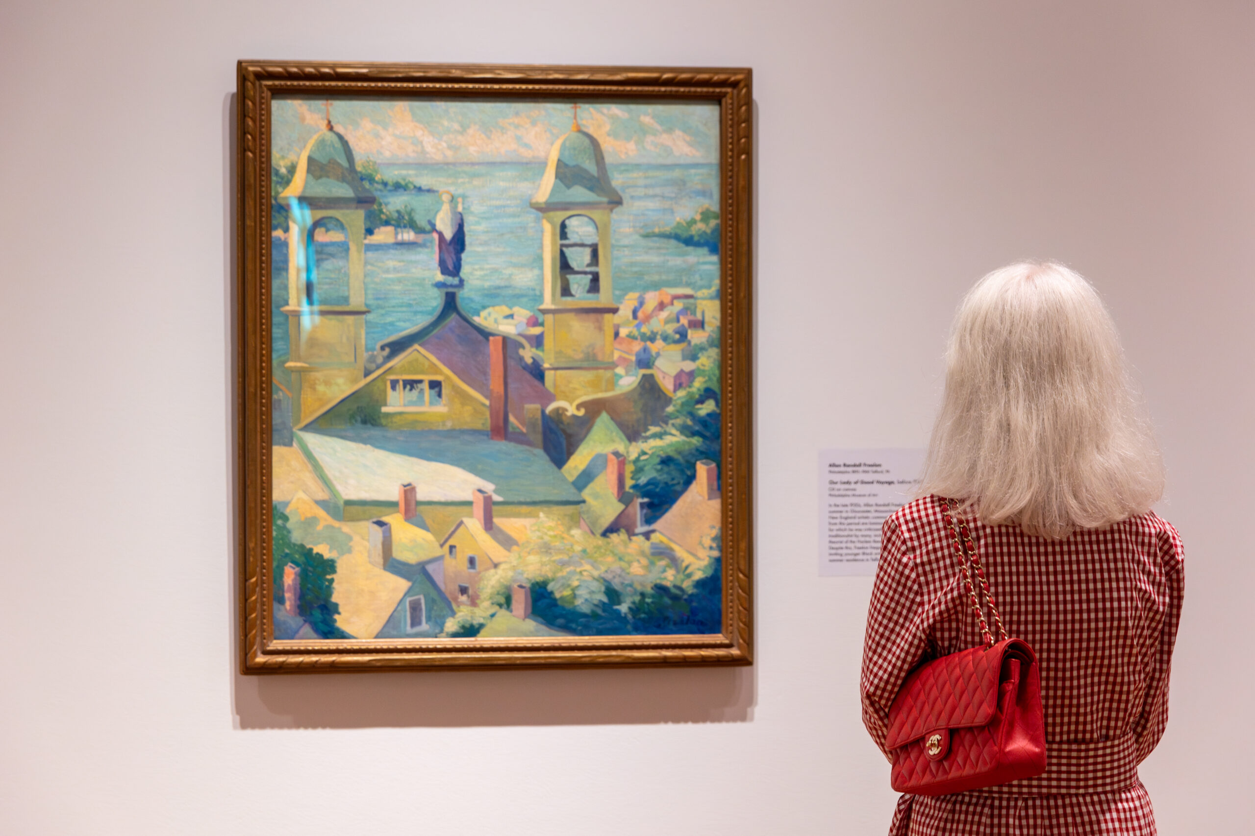 Visitor looking at work of art in Museum gallery